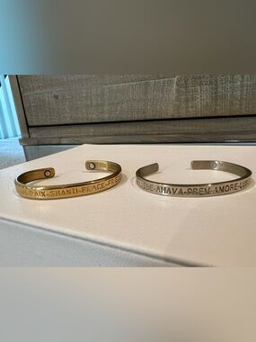 Sergio Lub gold tone “peace” and silver tone “love” cuff bracelets, extra small